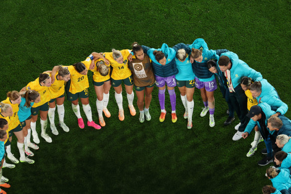 The Matildas huddle after victory in Sydney.