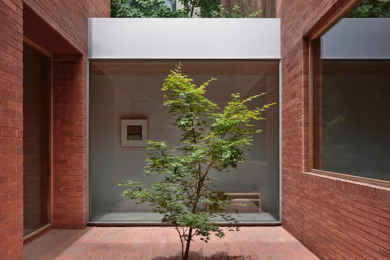 A point of difference is a central courtyard that separates the private wing from the more public side of the home.