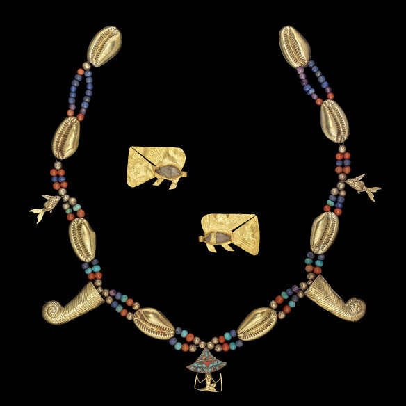 A 12th-dynasty girdle with gold amulets, beads and pendants comprising electrum, silver, lapis lazuli, feldspar, amethyst, cornelian and glass.