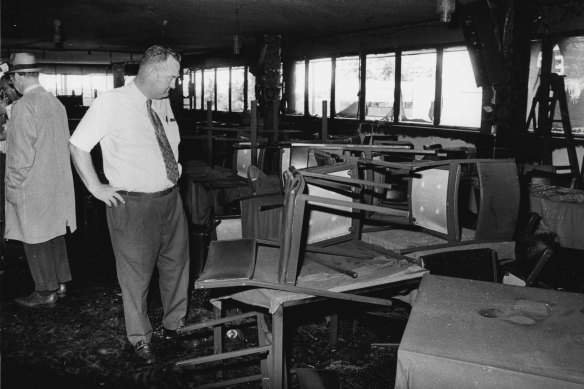 A detective examines the fire-damaged interior of the Whiskey Au Go Go nightclub on March 8, 1973