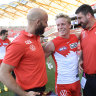 Swans star Isaac Heeney with assistants Jarrad McVeigh and Dean Cox.