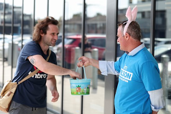 Tim Wilson was happy to don pink bunny ears and chat to people.