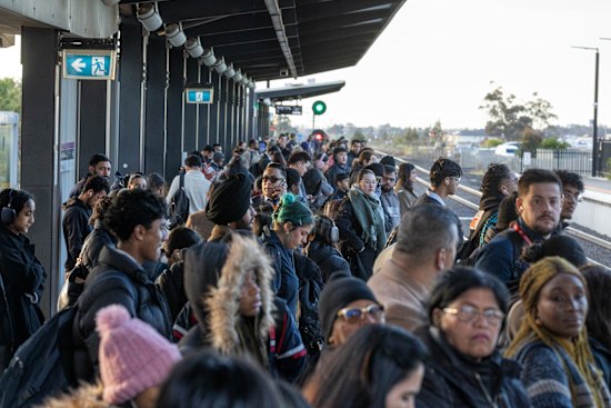 Commuters at Rockbank station on the Melton line, which is still served by overcrowded V/Line trains.   