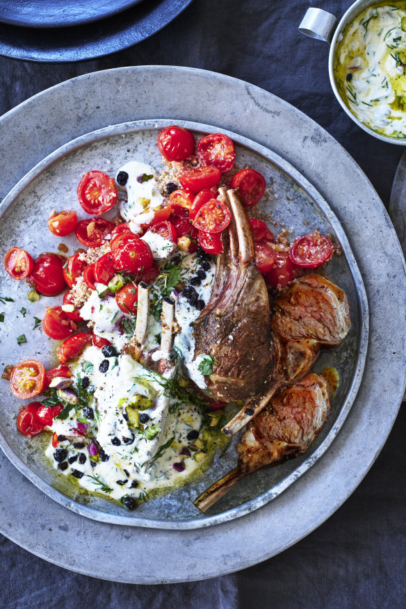 Baharat-spiced roast lamb with herbed burghul, blistered tomatoes and tahini yoghurt.