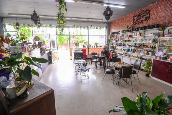 The cafe’s shelves (right) are stocked with eclectic gifts.