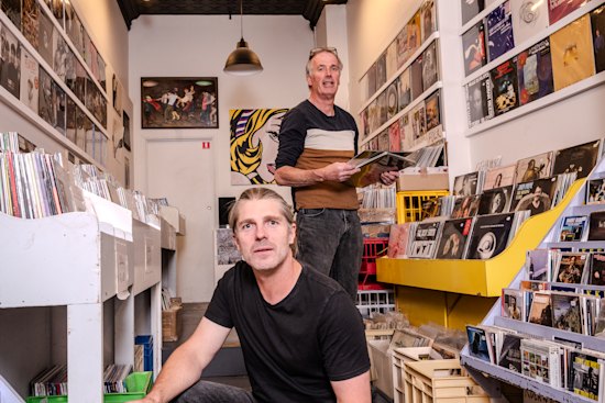 Leigh Carmichael (left) with Music Without Frontiers manager Mel Stewart in the Hobart record store. Carmichael made a vow to do everything he could to help save it.