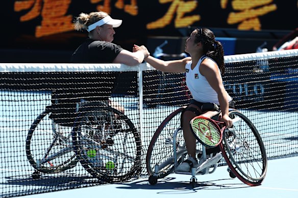 Yui Kamiji, of Japan, (right) shakes hands with Aniek Van Koot, of the Netherlands, after winning the women’s wheelchair singles final.