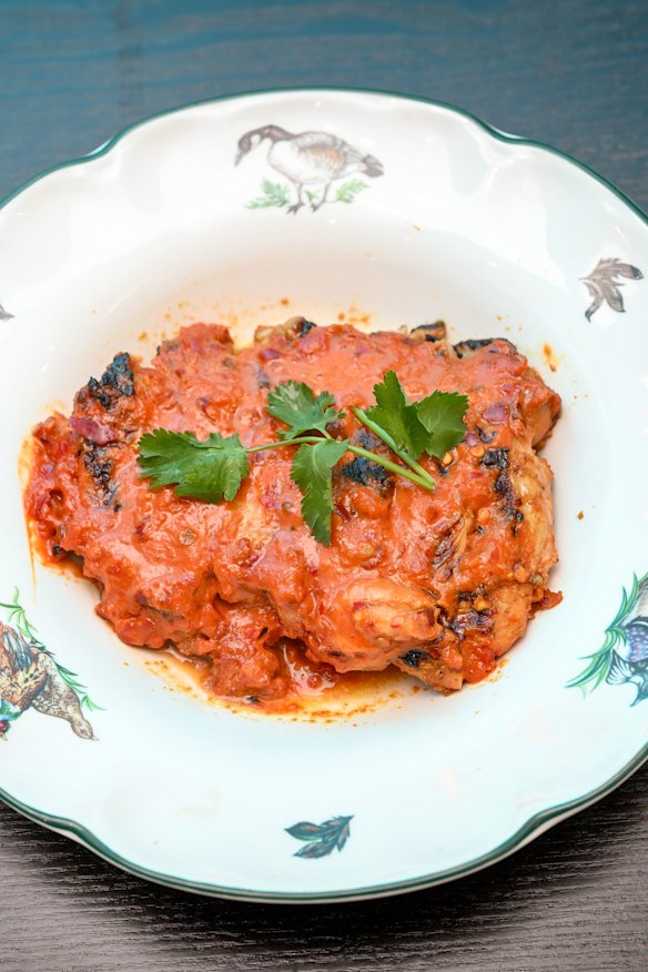 Grilled chicken thigh in red curry sauce.