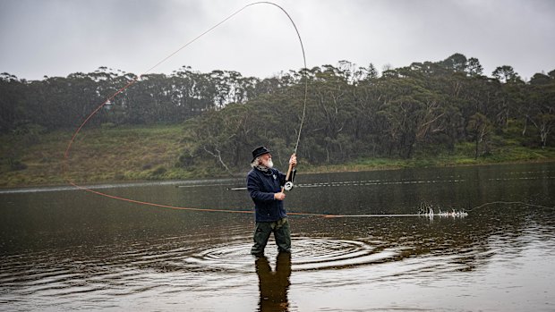 Master fly casting instructor Peter Morse practising his casting in Wentworth Falls Lake on Monday. He does not catch or eat fish from the lake.