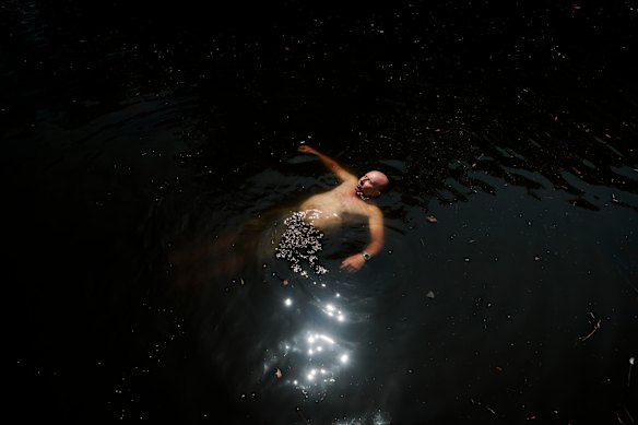 Local resident Barney Soloman swims in the Cooks River at Boat Harbour, Hurlstone Park (it’s not recommended)