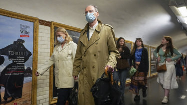 People wearing face masks to protect against COVID-19 on a platform at the Paris Metro. Virus cases are rising fast in France and other European countries after COVID-19 restrictions were lifted in the spring. 
