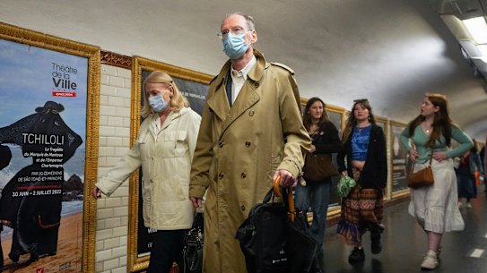 People wearing face masks to protect against COVID-19 on a platform at the Paris Metro. Virus cases are rising fast in France and other European countries after COVID-19 restrictions were lifted in the spring. 