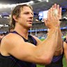 Nat Fyfe of the Dockers acknowledges supporters after winning the round 14 AFL match between North Melbourne Kangaroos and Fremantle Dockers at Optus Stadium.