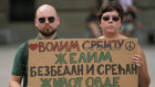 Protesters in Belgrade hold a banner that reads: “I love Serbia, I want a safe and happy life here.”