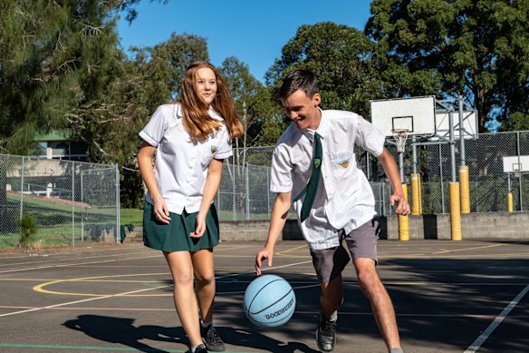 Caringbah High students have a game of basketball.
