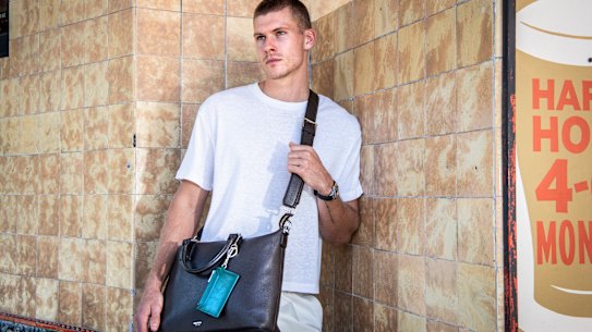 Australian accessories label Oroton has relaunched its male accessories line. capitalising on the popularity of handbags for men. Model Russell White gives an Oroton bag the pub test in Redfern.
