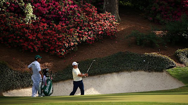 Hideki Matsuyama plays a shot from the bunker at the 12th hole at Augusta National.