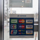 A sign advertises payment services by Visa and Mastercard in the window of the Army of Russia store in Moscow. Both payment services said they would halt operations in Russia.