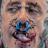 Andrew from Spain shows his split tongue and piercings at the the Gods of Ink Tattoo Convention in Frankfurt