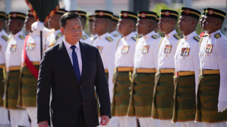 Cambodian Prime Minister Hun Manet inspects an honour guard during a visit to Malaysia on Tuesday. The prime minister’s family retain control of many senior roles in the Cambodian government. 