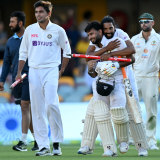 Rishabh Pant celebrates victory with his teammates.