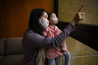 Karee Chan, pictured with her daughter Cathleen, age 2, was pregnant when she was forced to evacuate Mascot Towers. She has been unable to move back.