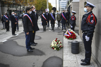 Saint-Denis Mayor Mathieu Hanotin, left, and French Prime Minister Jean Castex participate in a wreath laying ceremony, marking the anniversary of the November 13, 2015 attacks outside the stadium Stade de France in Saint Denis.