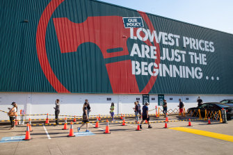 People line up to shop at Bunnings in August, before it had to revert to click-and-collect only because of restrictions.