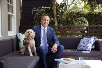 NSW Rugby League CEO Andrew Abdo and the family cavoodle Buddy at home in Roseville.