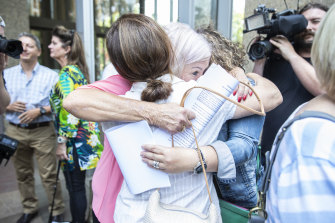 Women hug outside court after the findings in the pelvic mesh judgment were delivered on Thursday.
