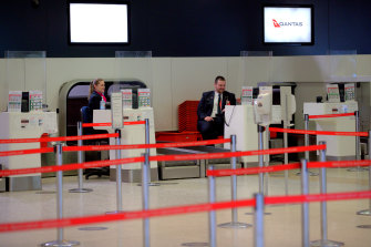 Qantas staff at an empty Melbourne Airport in July.