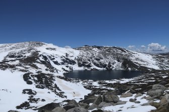 Blue Lake in the Snowy Mountains, pictured on Wednesday, has been blanketed in snow. 