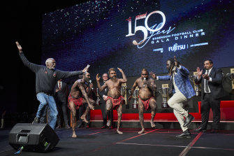 Tiwi Islands dancers, Senior Elder CJ Kerinauia (left), Barry Ullungura jnr, Bon Gerard Timeapatua, Joseph Pilakui, and former Essendon footballer Anthony McDonald-Tipungwuti (second right) perform.