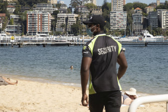 A security guard patrolled Redleaf Beach when it was closed due to a sewage problem in October 2020.