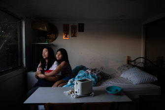 Su Myat and her daughter Mee Mee, in their shared bedroom in Blacktown. They also eat in that room.