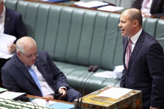 Prime Minister Scott Morrison on the phone during Question Time.