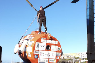 Jean-Jacques Savin, pictured in 2018 atop the barrel he previously used to cross the Atlantic.