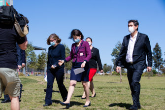 Premier Gladys Berejiklian, centre, arriving at Mondayâs press conference.