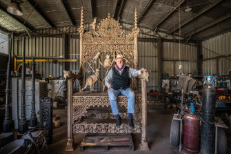 Artist Stevens Vaughn on his throne at Billmans Foundry in Castlemaine. It will go on display in Lorne next month. 
