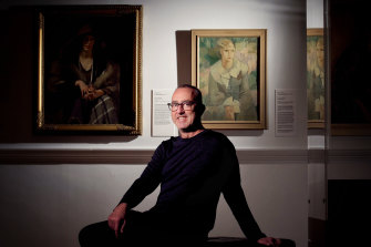 Geelong Gallery director Jason Smith in front of the Grace Crowley portrait of Miss M Roberts.