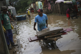 Residents cleaned out their homes in Itapetinga, Brazil, as the flood waters subsided. 
