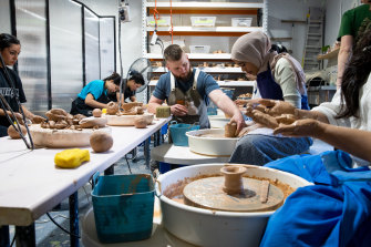 Students learning pottery at Clay Sydney wher<em></em>e classes co<em></em>ntinue to grow in popularity.