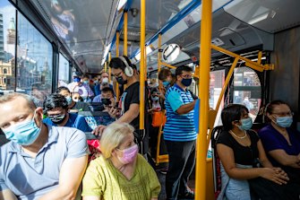 A packed bus heads west away from the CBD.