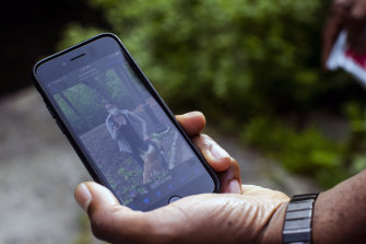 Christian Cooper displays the viral video recording of Amy Cooper (no relation) on his smartphone in New York's Central Park.