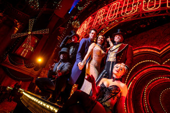 Moulin Rouge! cast pose on stage at the Regent.