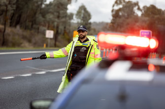 Victoria Police check south-bound vehicles at the border near Chiltern in July.