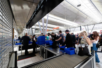 Shuttered security lanes during peak hour at Sydney Airport are causing a major bottleneck for passengers. 