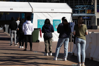 Year 12 students queuing for their COVID-19 vaccine at Qudos Bank Arena last year.