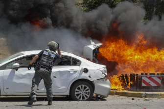 Missiles fired from Gaza set cars alight in the southern Israeli town of Ashkelon.