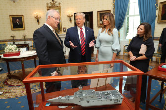 Donald Trump presents Scott Morrison with a model of one of the combat vessels ASX-listed shipbuilder Austal is building for the US Navy. 